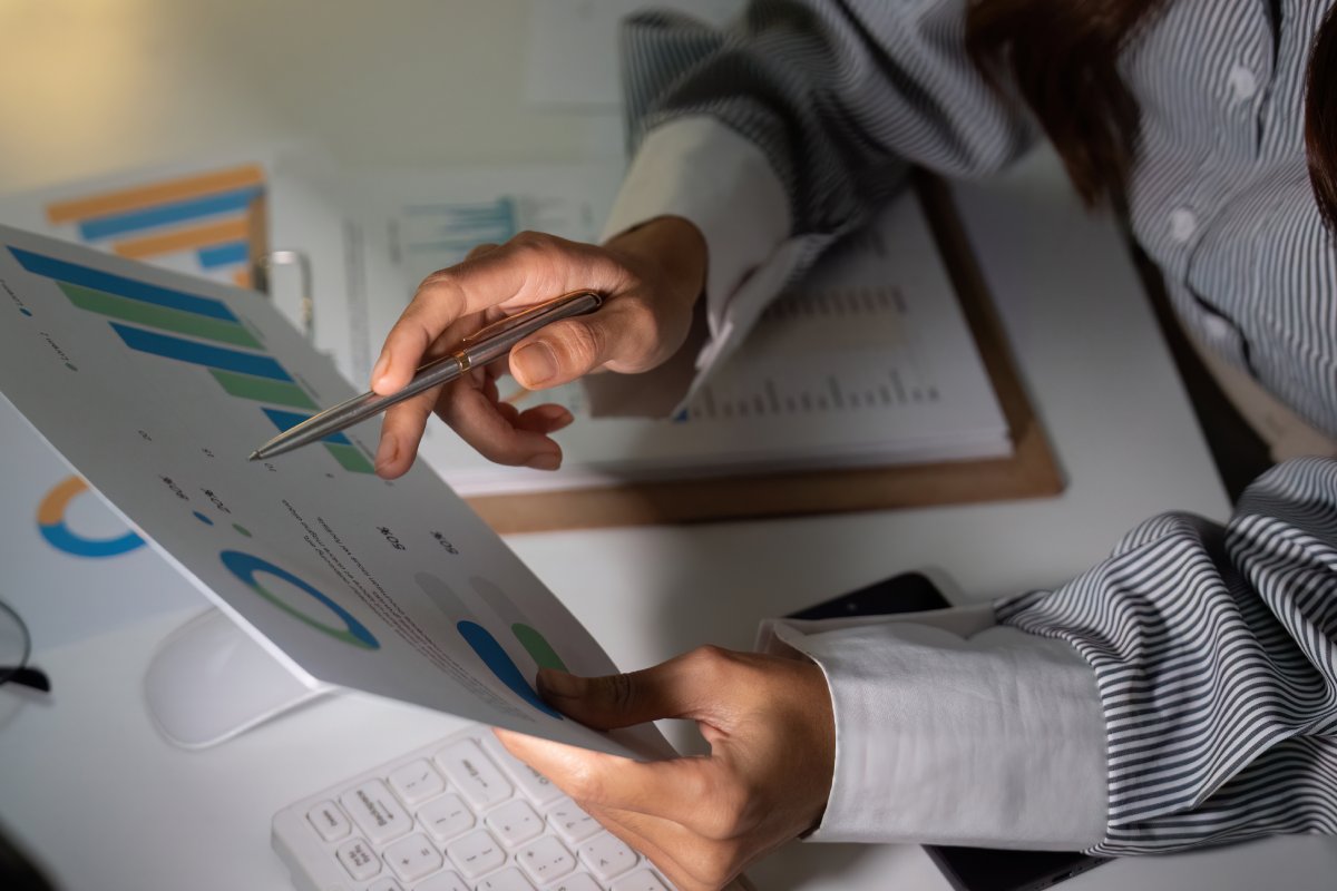 CFO reviewing training investment proposal with compelling ROI projections